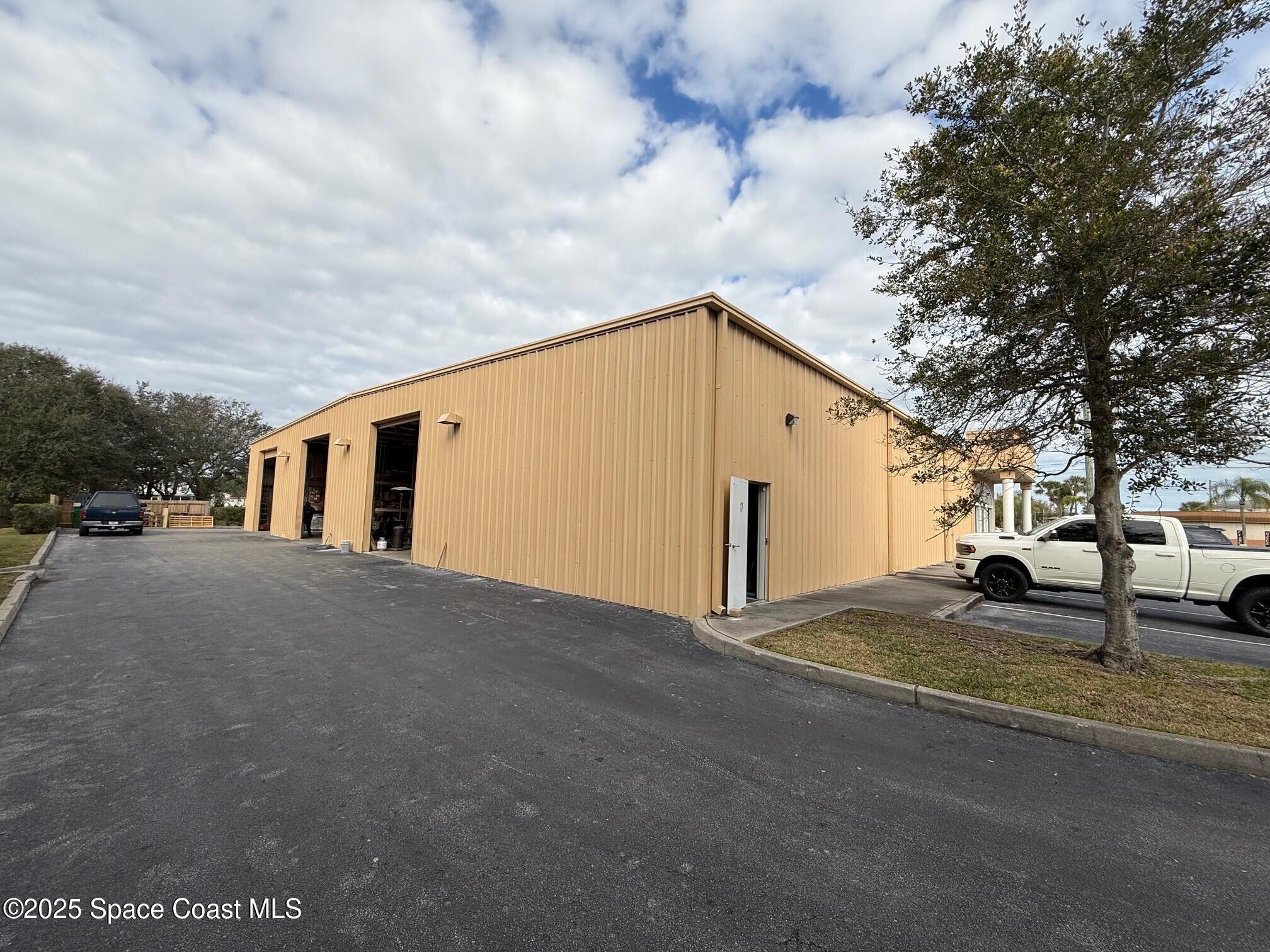 1301 Lake Washington Road Melbourne, FL 32935 - Photo 8 of 13 a view of a house with a yard