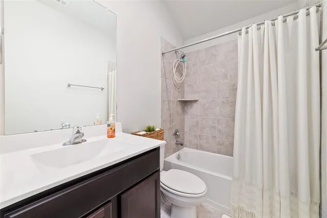 a bathroom with a sink a toilet and a bathtub