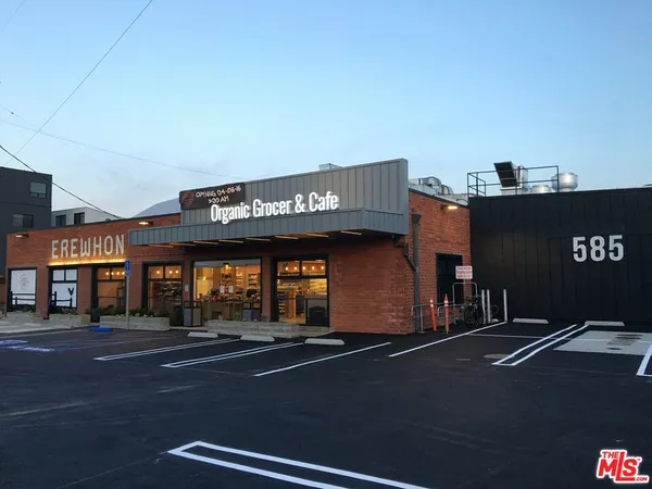 a front view of a building with parking space