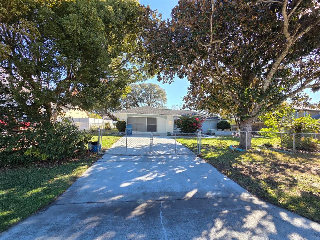 a view of a yard with swimming pool