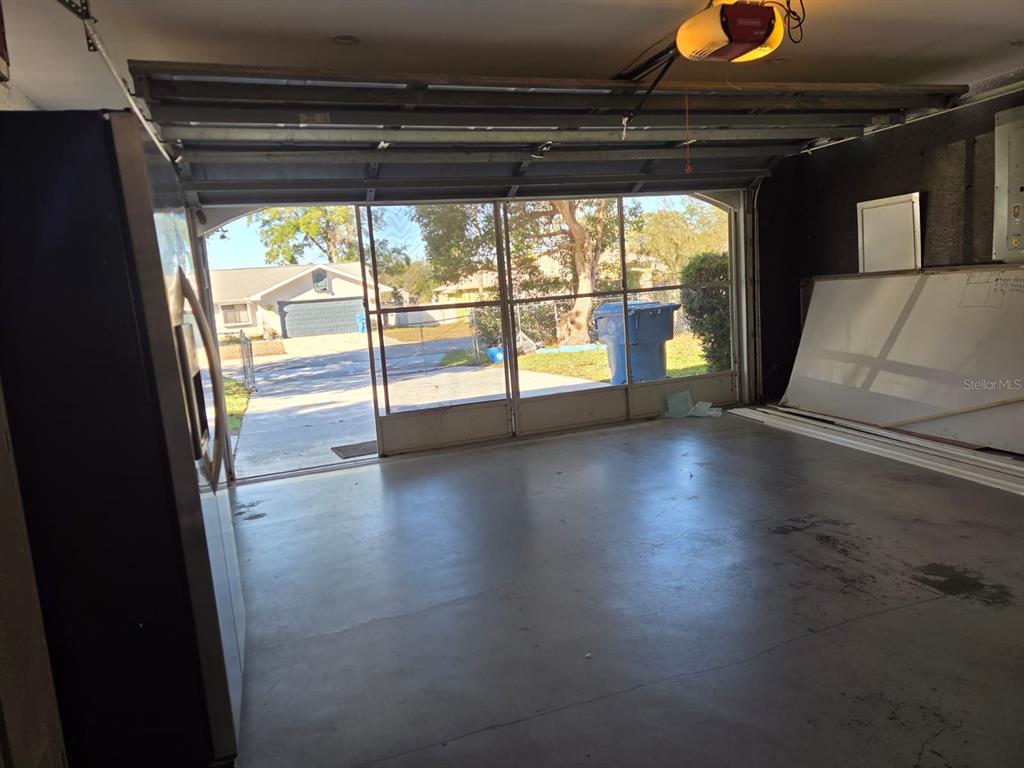 2202 Perry Avenue Spring Hill, FL 34609 - Photo 9 of 11 a view of empty room with wooden floor and fan