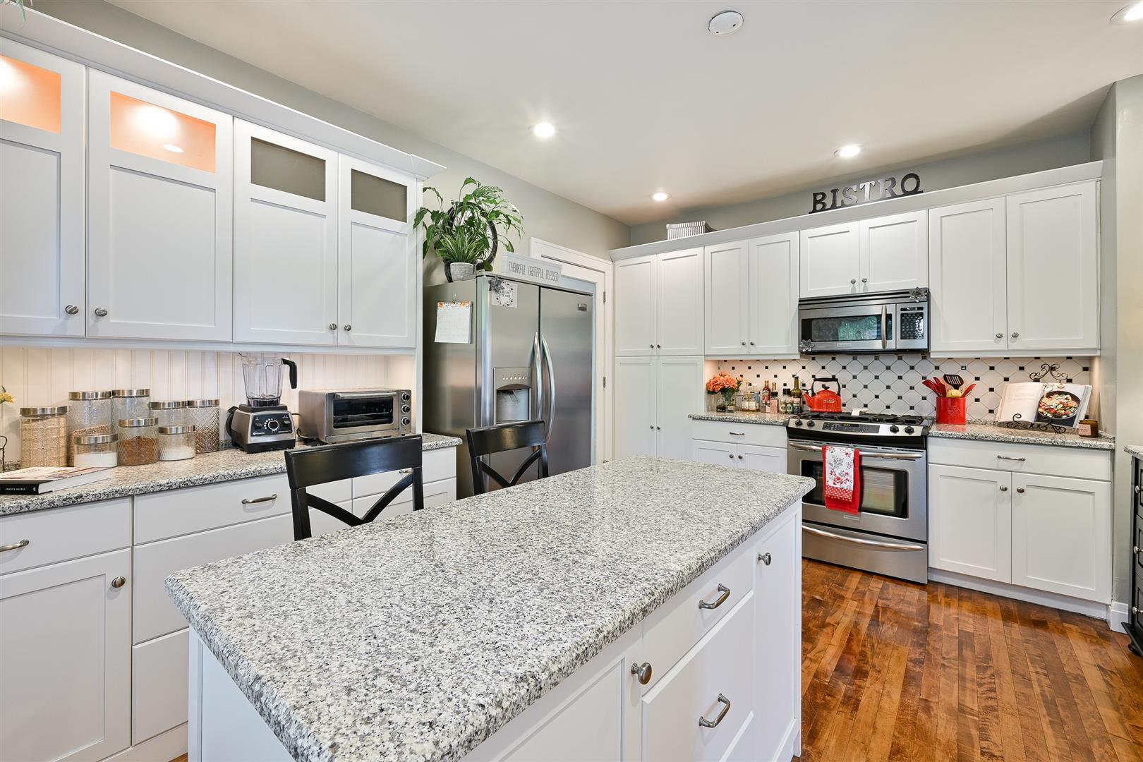 804 Warrenville Road Wheaton, IL 60189 - Photo 12 of 30 a kitchen with stainless steel appliances granite countertop a sink stove and refrigerator