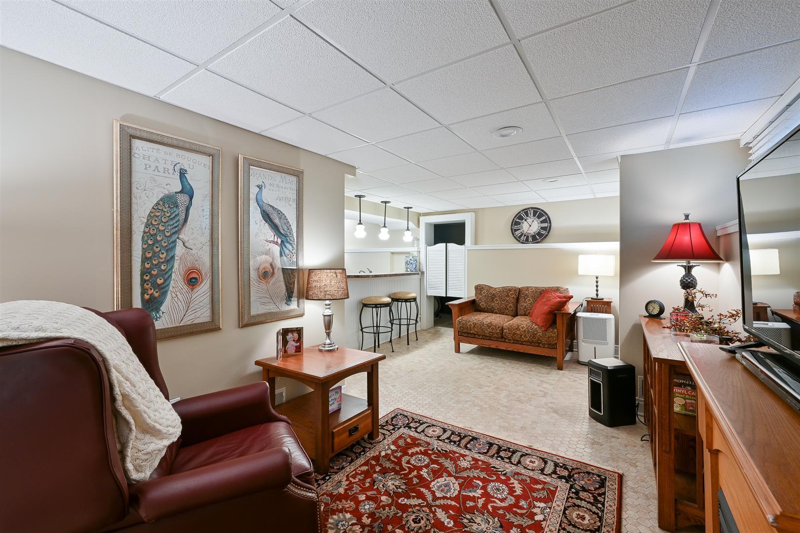 804 Warrenville Road Wheaton, IL 60189 - Photo 17 of 30 a living room with furniture and a rug