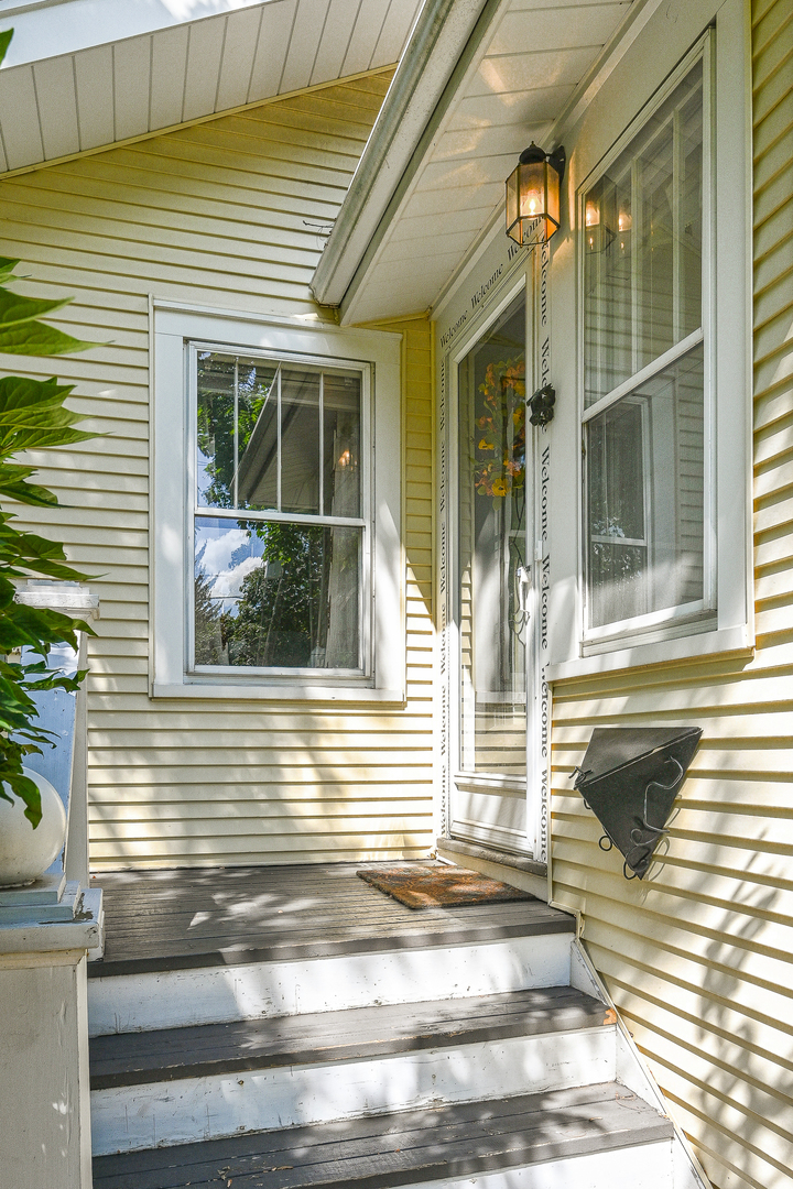 804 Warrenville Road Wheaton, IL 60189 - Photo 3 of 30 a view of a house with a window and wooden floor