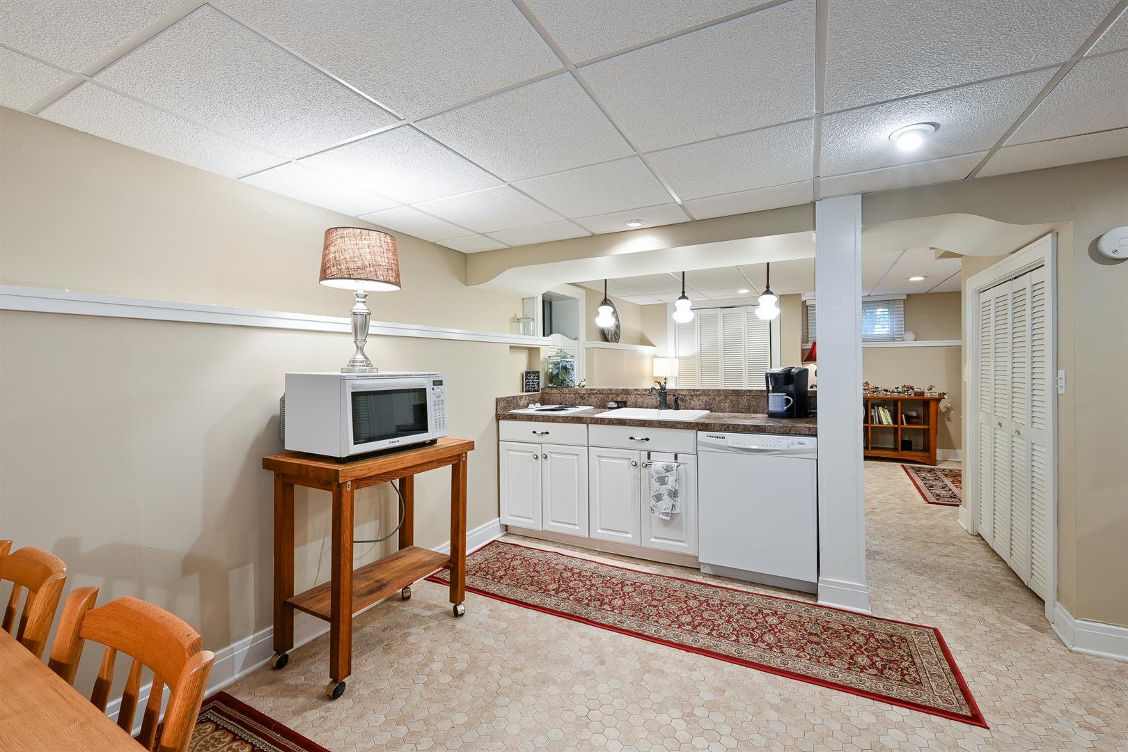 804 Warrenville Road Wheaton, IL 60189 - Photo 21 of 30 a open kitchen with white cabinets and stainless steel appliances