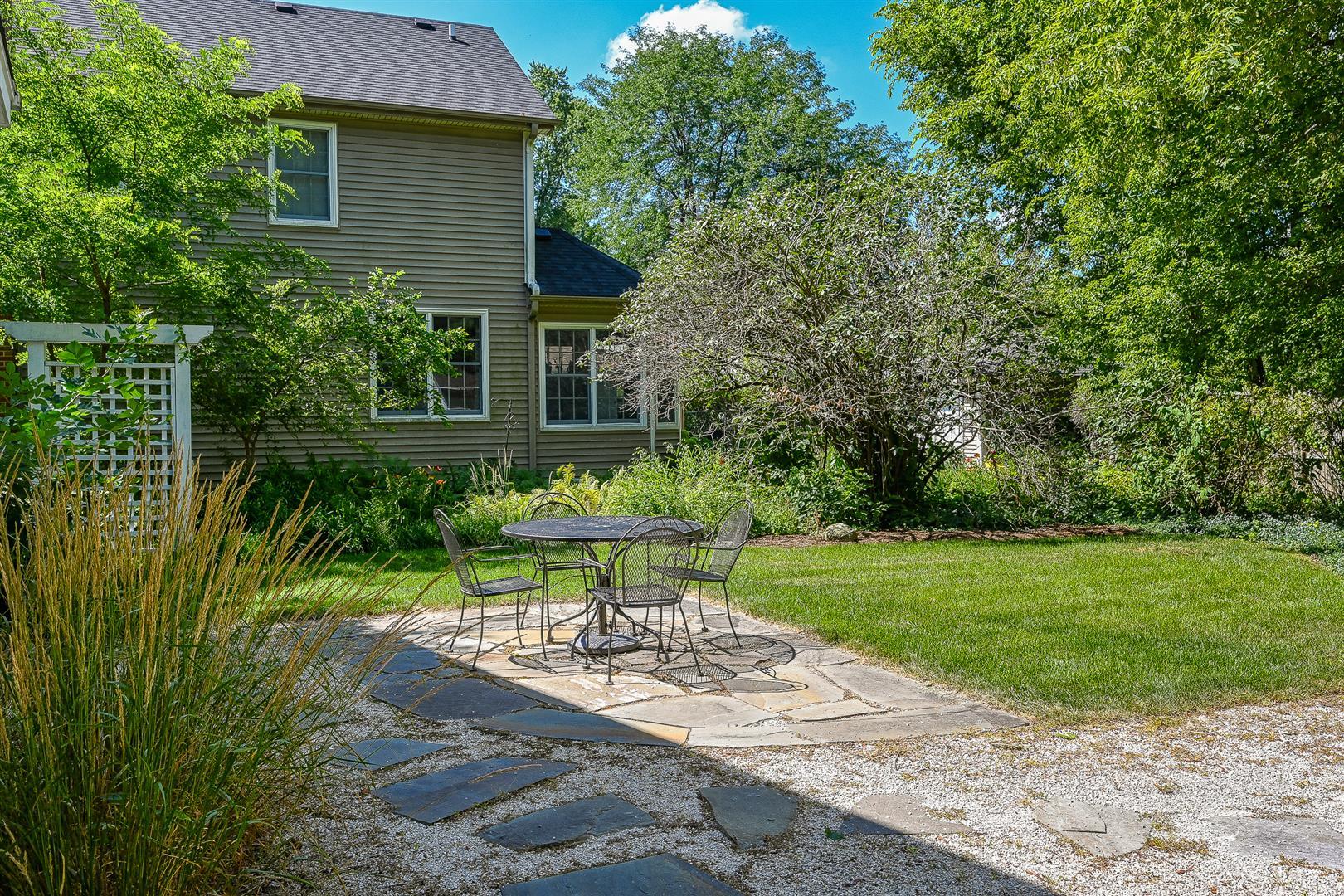 804 Warrenville Road Wheaton, IL 60189 - Photo 25 of 30 a view of a chair and table in backyard of the house