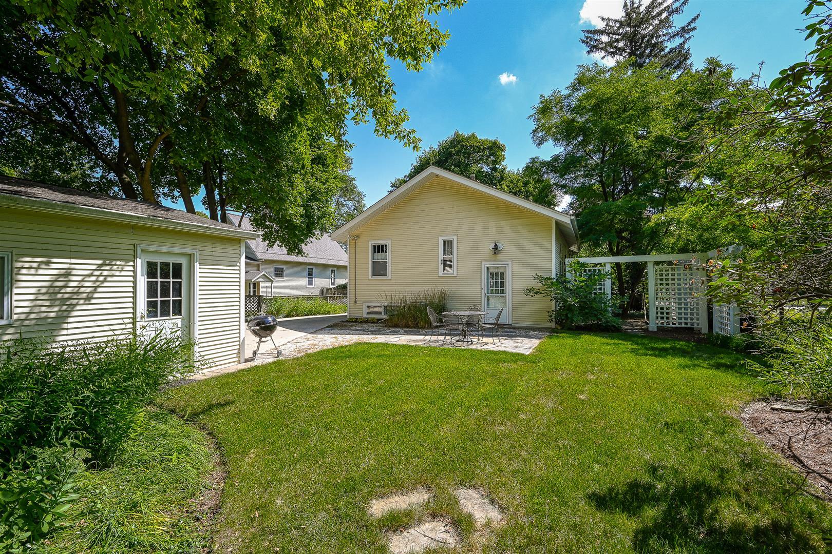 804 Warrenville Road Wheaton, IL 60189 - Photo 27 of 30 a view of a house with a yard and sitting area