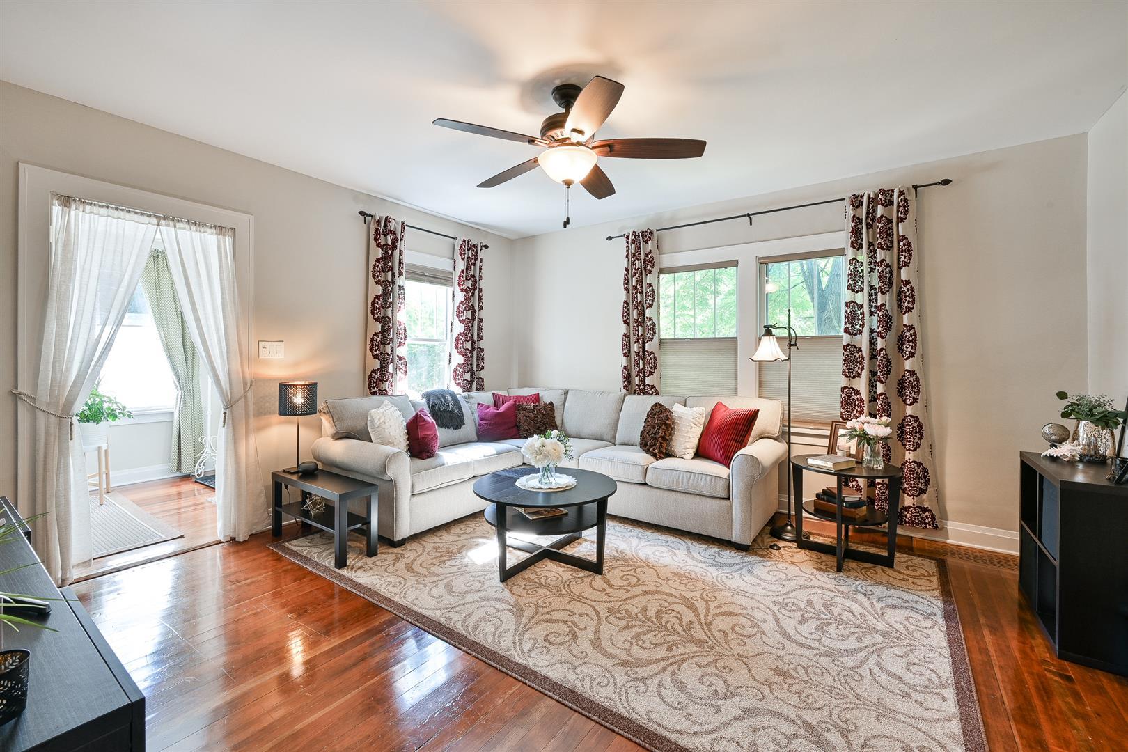 804 Warrenville Road Wheaton, IL 60189 - Photo 7 of 30 a living room with furniture and a flat screen tv