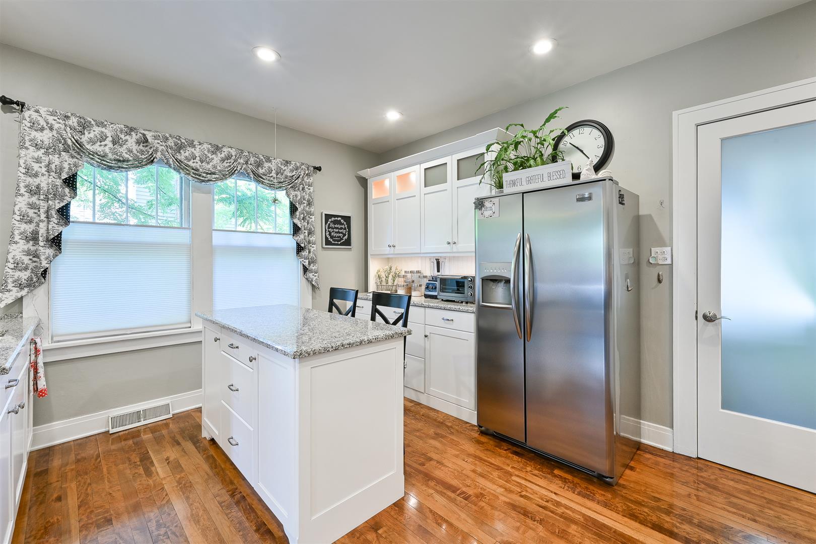 804 Warrenville Road Wheaton, IL 60189 - Photo 10 of 30 a kitchen with stainless steel appliances granite countertop a refrigerator and a sink