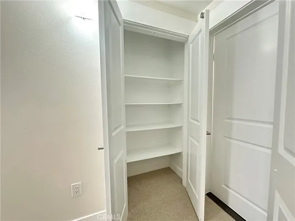 a view of an empty walk in closet