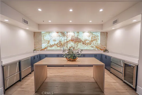 a view of kitchen with stainless steel appliances granite countertop counter space and cabinets
