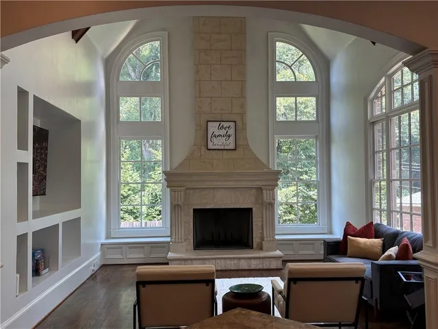 a dining room with furniture and wooden floor