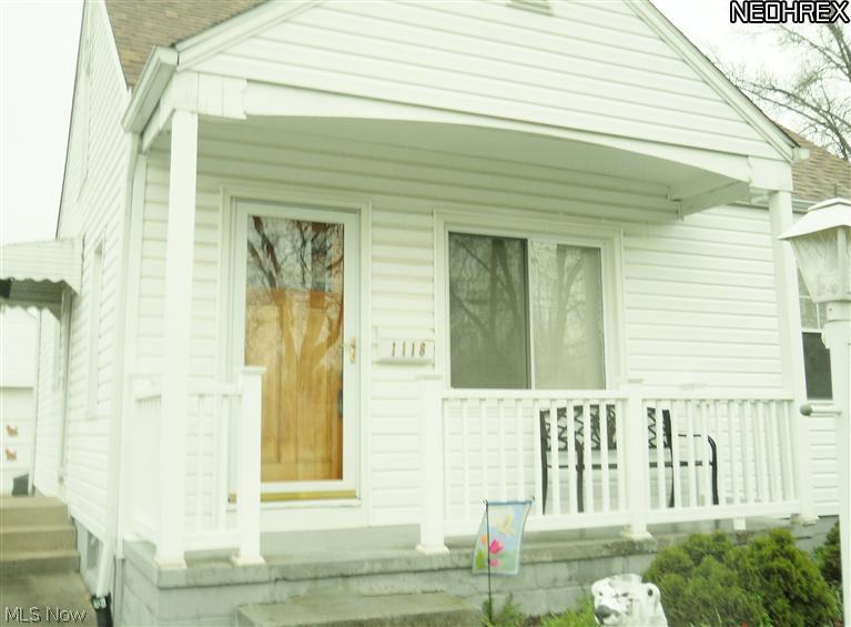 1118 Reed Avenue Akron, OH 44306 - Photo 3 of 9 Newer vinyl siding, newer dimensional roof shingles, full glass storm door to keep the weather out and the sunshine in! Low maintenance, high value! Call to see this cute Cape Cod today!
