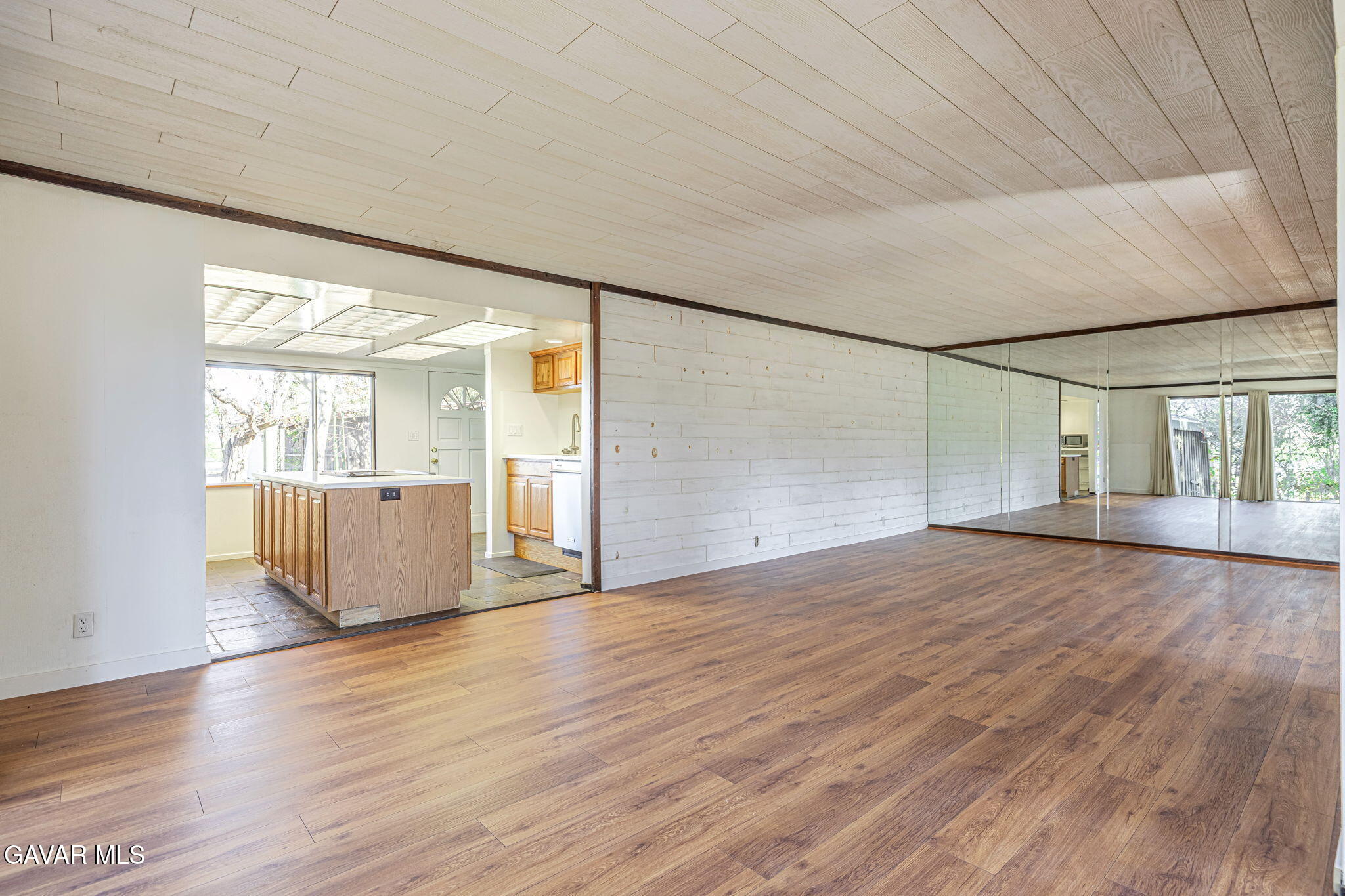 4819 Columbia Way Lancaster, CA 93536 - Photo 13 of 33 an empty room with wooden floor and windows