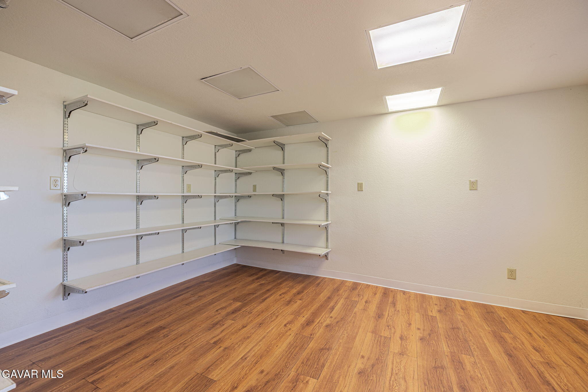 4819 Columbia Way Lancaster, CA 93536 - Photo 16 of 33 a view of a room with wooden floor and white walls