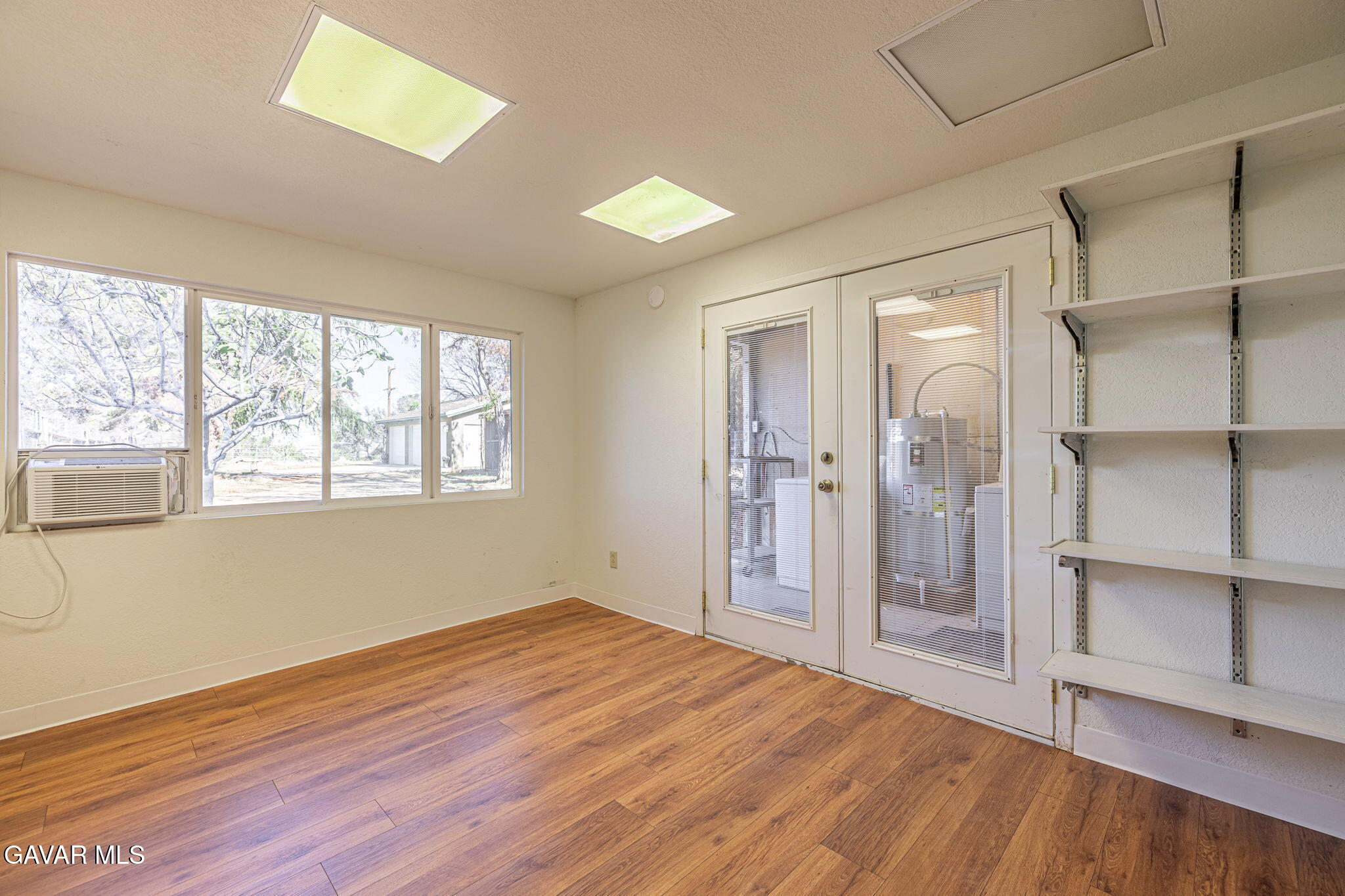 4819 Columbia Way Lancaster, CA 93536 - Photo 17 of 33 a view of empty room with wooden floor and fan