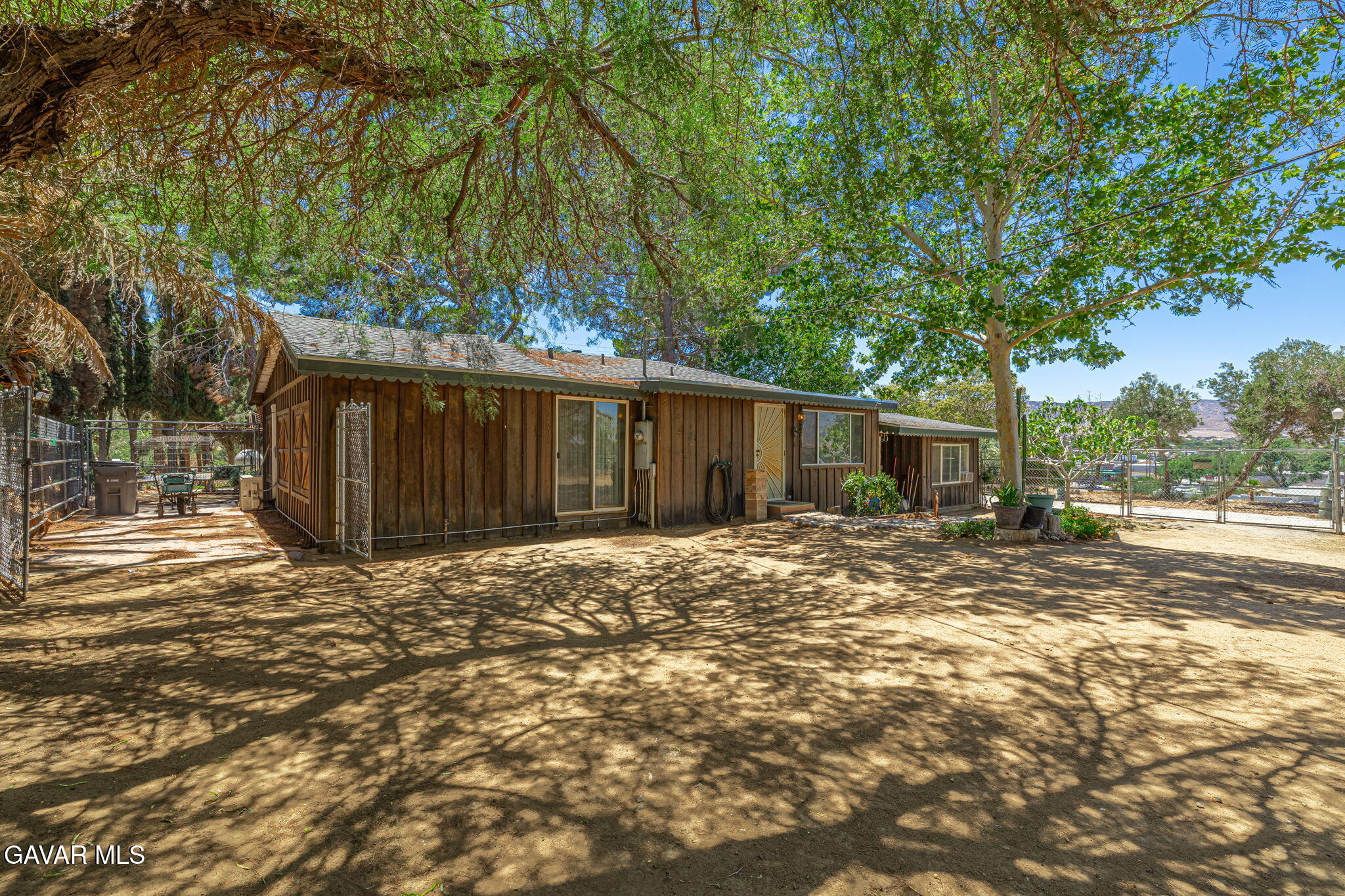 4819 Columbia Way Lancaster, CA 93536 - Photo 19 of 33 a view of a house with backyard and tree