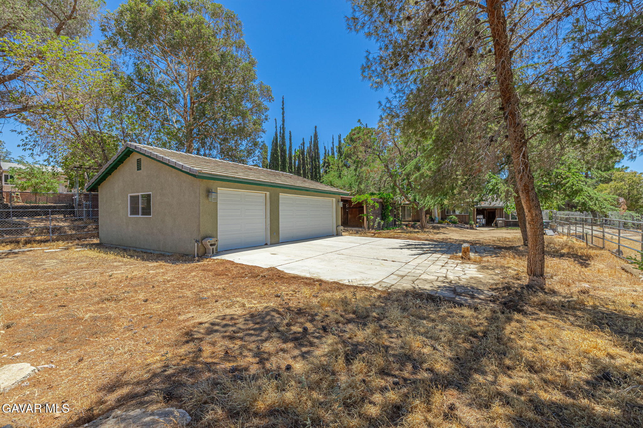 4819 Columbia Way Lancaster, CA 93536 - Photo 21 of 33 a view of garage yard and tree