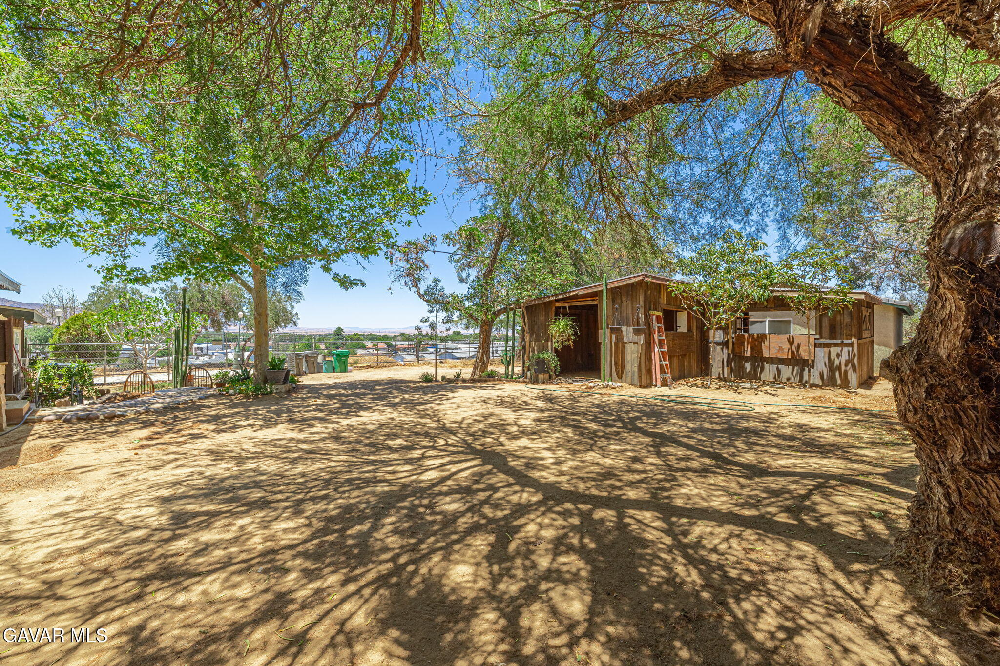 4819 Columbia Way Lancaster, CA 93536 - Photo 23 of 33 a view of road with large trees