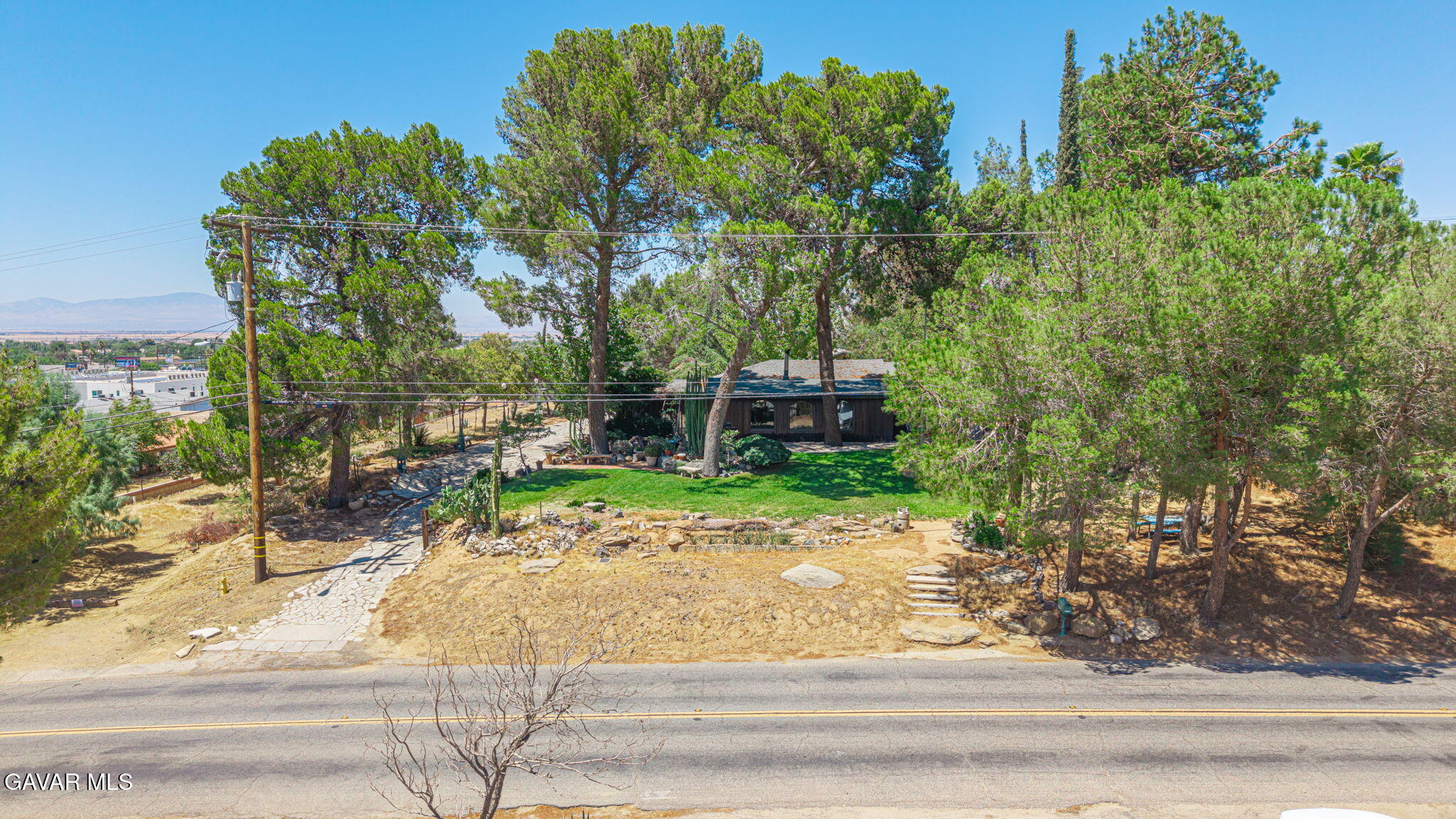 4819 Columbia Way Lancaster, CA 93536 - Photo 33 of 33 a backyard of a house with table and chairs