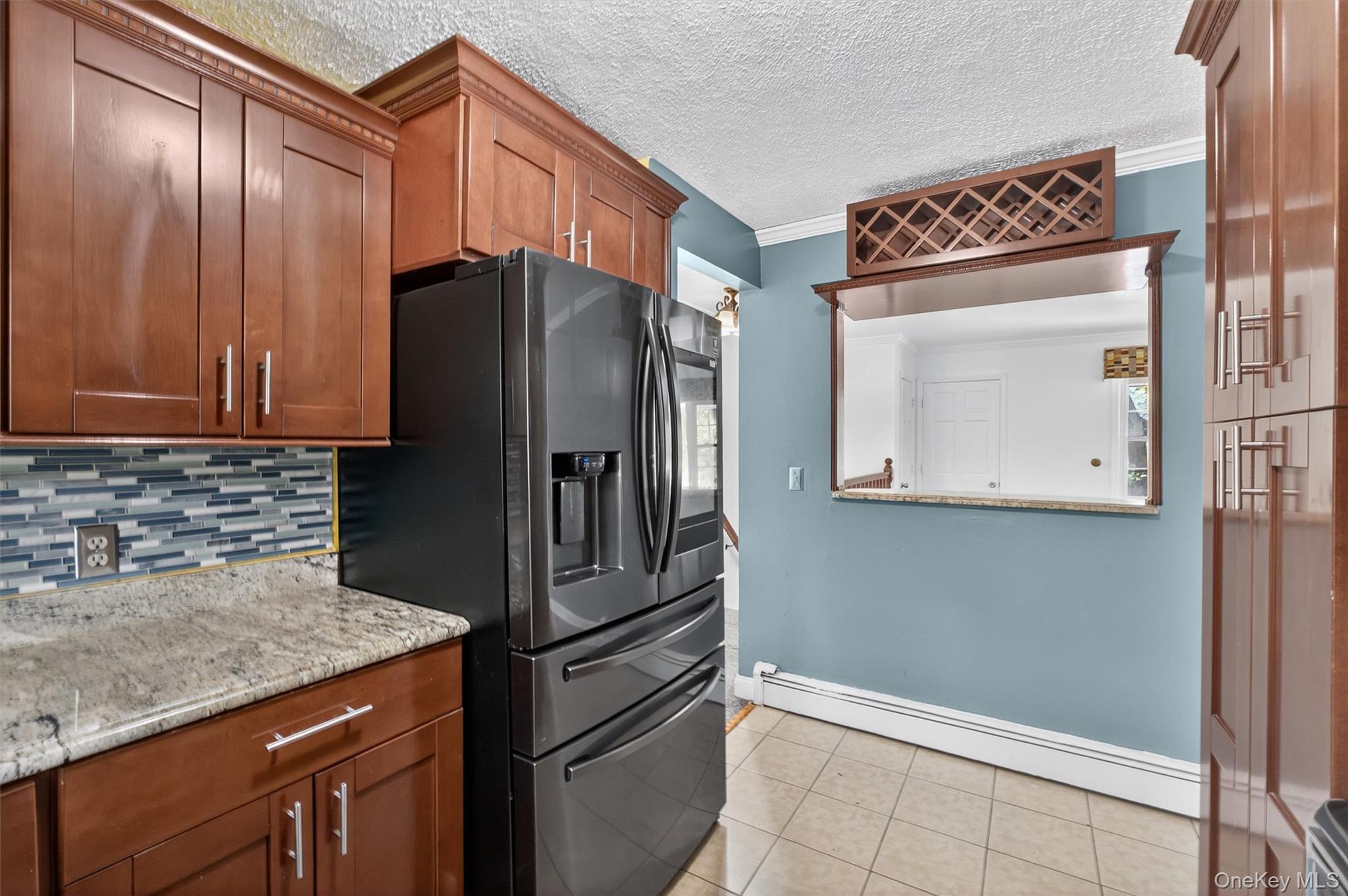 2710 South Road, Unit A4 Poughkeepsie, NY 12601 - Photo 12 of 17 a kitchen with stainless steel appliances granite countertop a refrigerator and a sink
