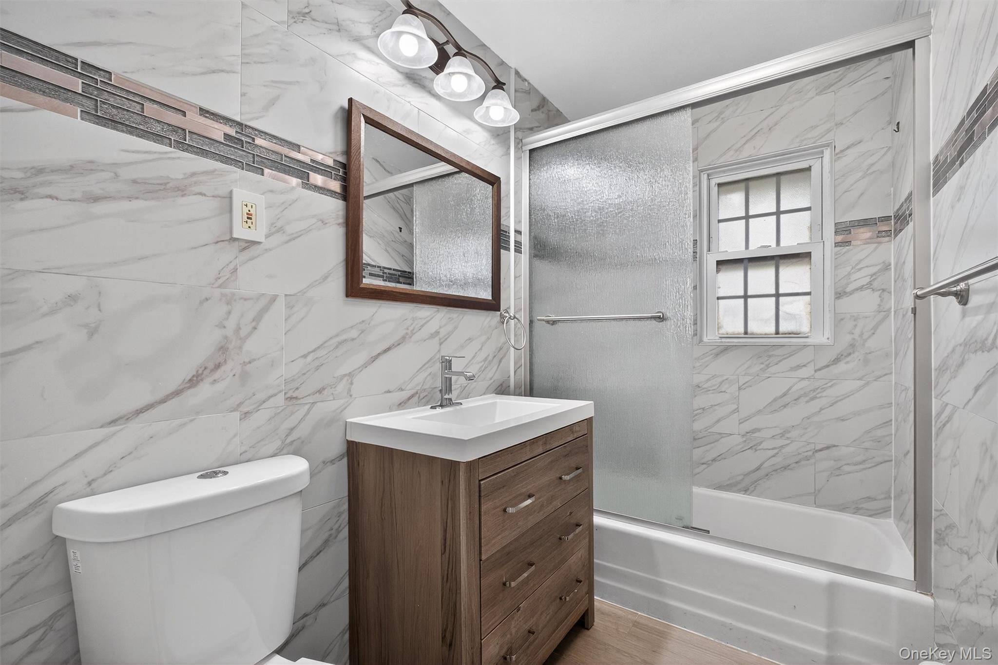 2710 South Road, Unit A4 Poughkeepsie, NY 12601 - Photo 15 of 17 a bathroom with a sink toilet and shower