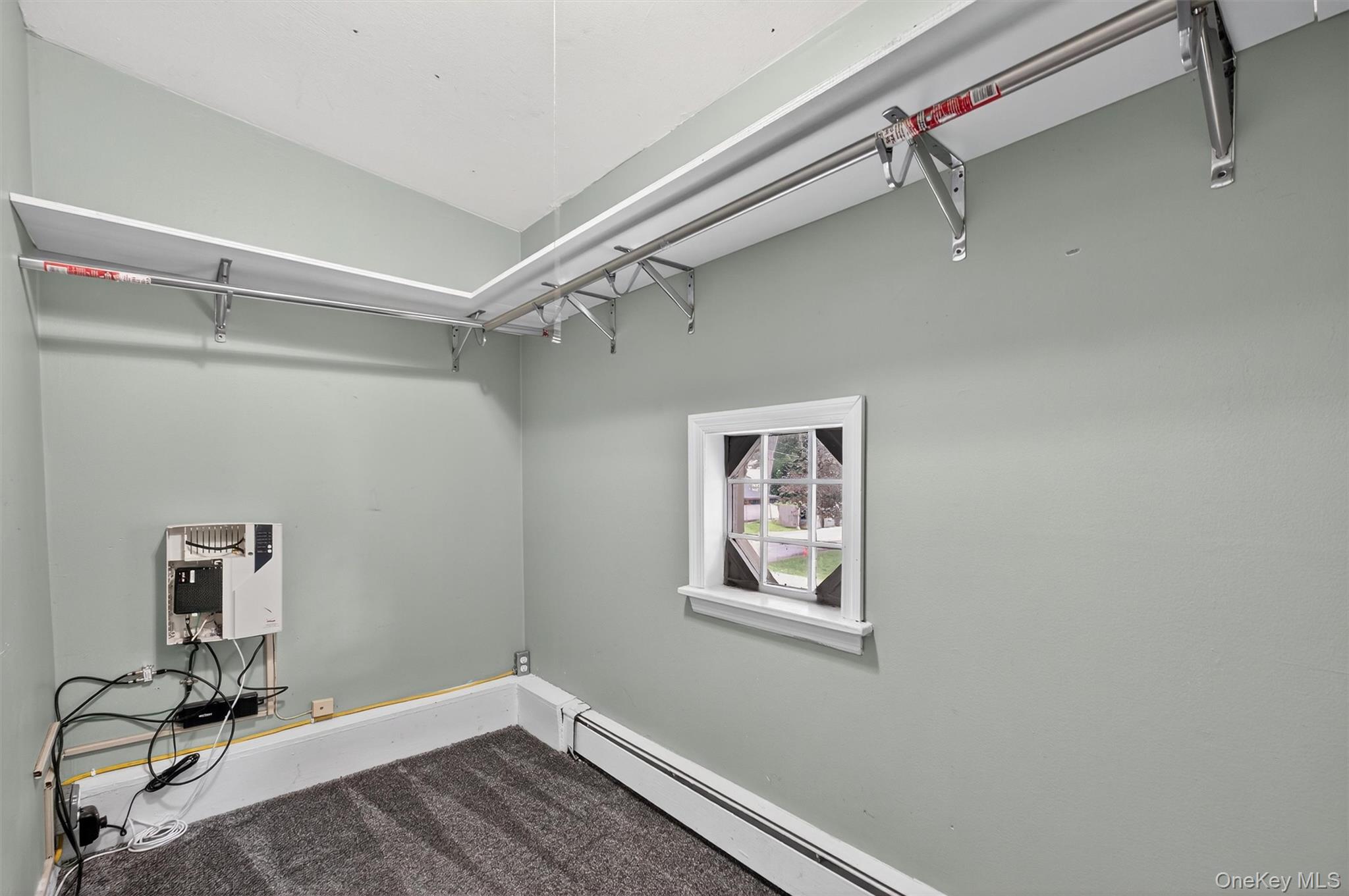 2710 South Road, Unit A4 Poughkeepsie, NY 12601 - Photo 17 of 17 a view of a room with rack on the wall and a window