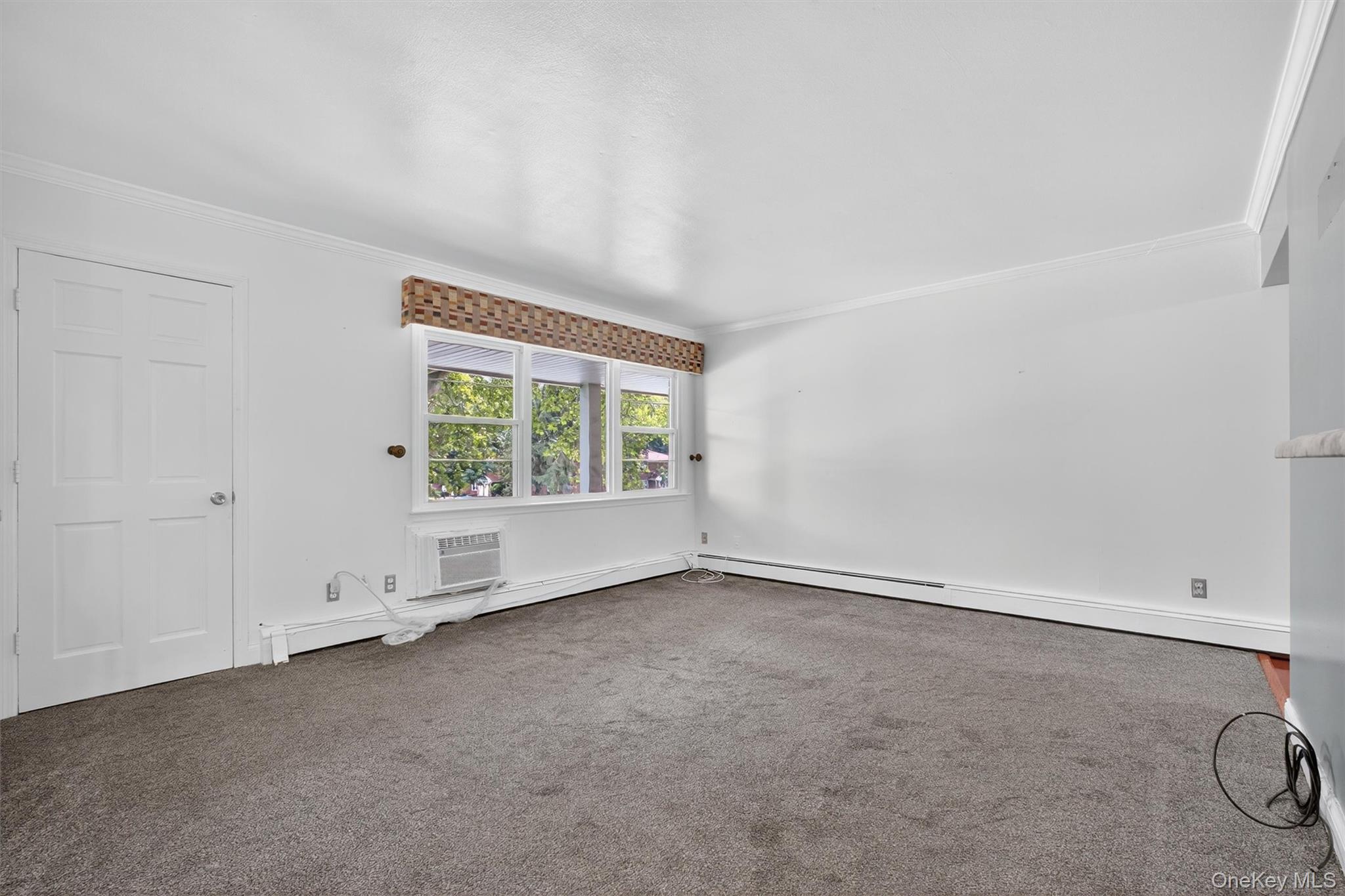 2710 South Road, Unit A4 Poughkeepsie, NY 12601 - Photo 3 of 17 an empty room with a window