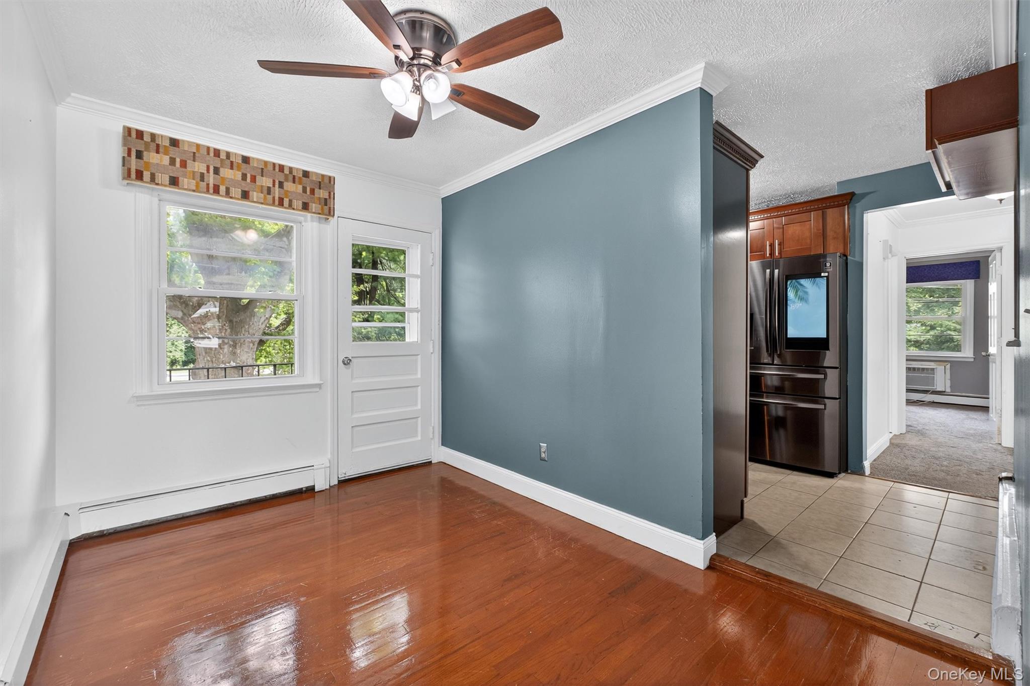 2710 South Road, Unit A4 Poughkeepsie, NY 12601 - Photo 7 of 17 wooden floor in an empty room with a window
