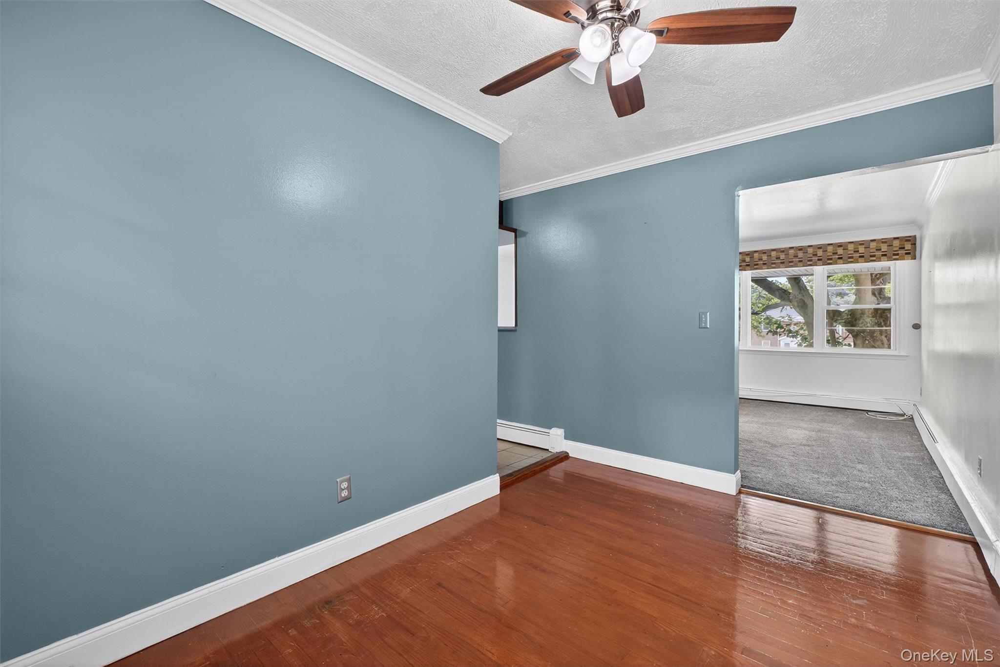 2710 South Road, Unit A4 Poughkeepsie, NY 12601 - Photo 8 of 17 an empty room with wooden floor and closet