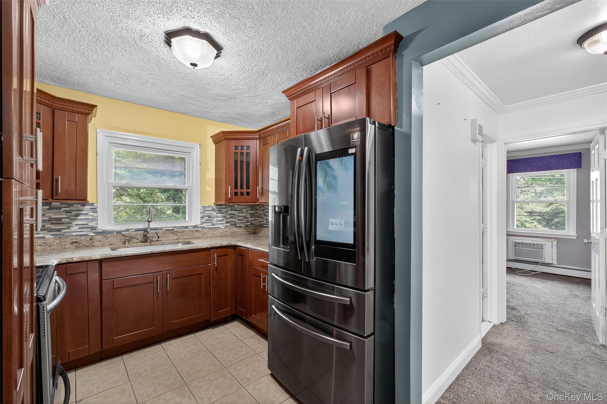 2710 South Road, Unit A4 Poughkeepsie, NY 12601 - Photo 10 of 17 a kitchen with a refrigerator and a sink