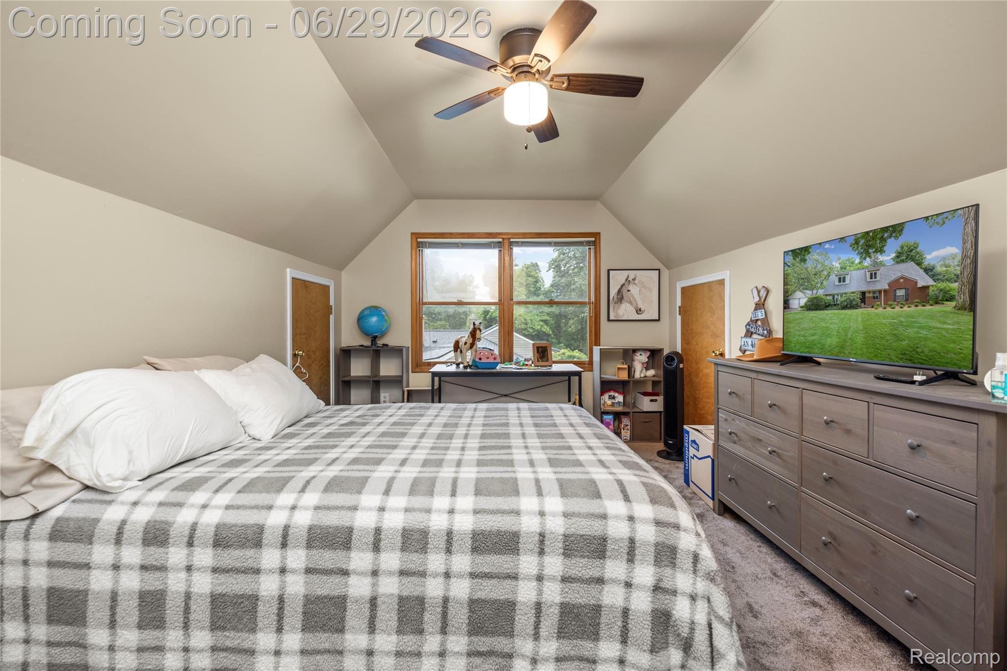 6085 Worlington Road Bloomfield Hills, MI 48301 - Photo 52 of 75 Bedroom featuring vaulted ceilings, a ceiling fan with integrated lighting, wood-trim windows, and neutral wall tones