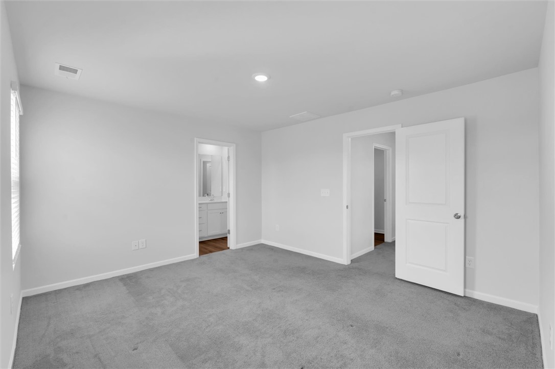 515 Brasstown Court Pendleton, SC 29670 - Photo 11 of 25 This inviting primary bedroom suite features soft carpeting, recessed lighting, and direct access to a private bathroom.