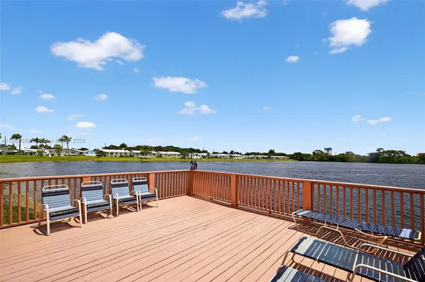 a view of balcony with furniture