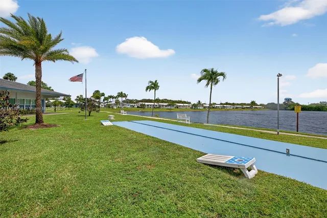 a view of yard with swimming pool and outdoor seating