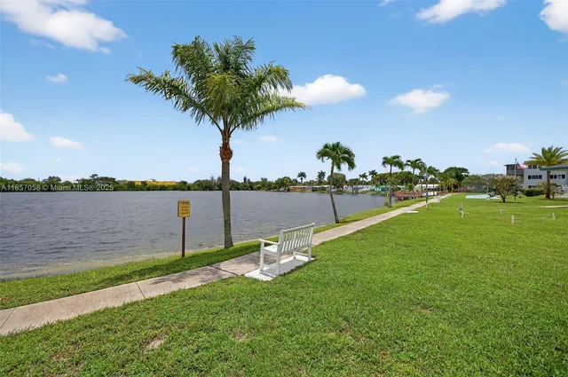a view of a lake with a big yard