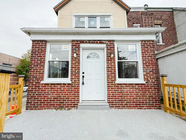 a view of a brick house with a door