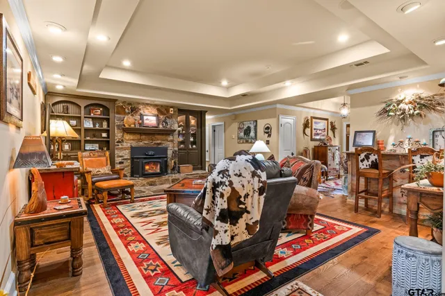 a living room with lots of furniture and a fireplace
