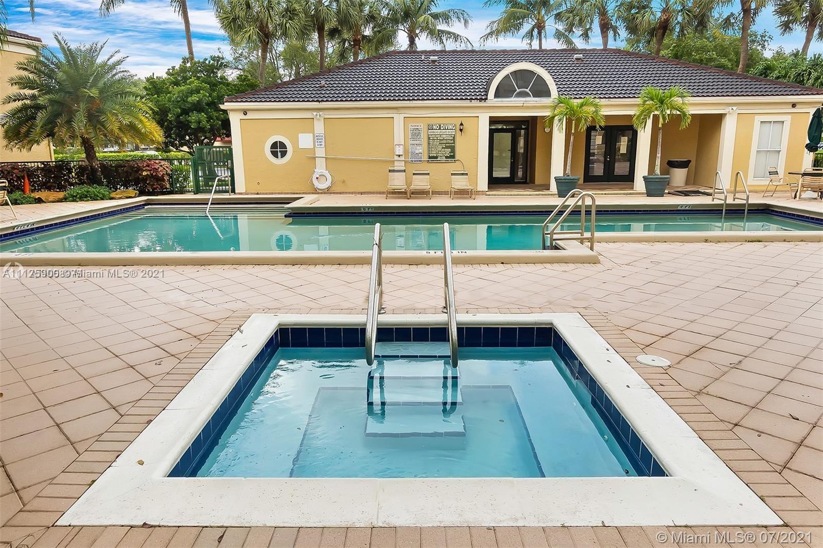 833 Riverside Drive, Unit 817 Coral Springs, FL 33071 - Photo 3 of 10 a front view of a house with garden