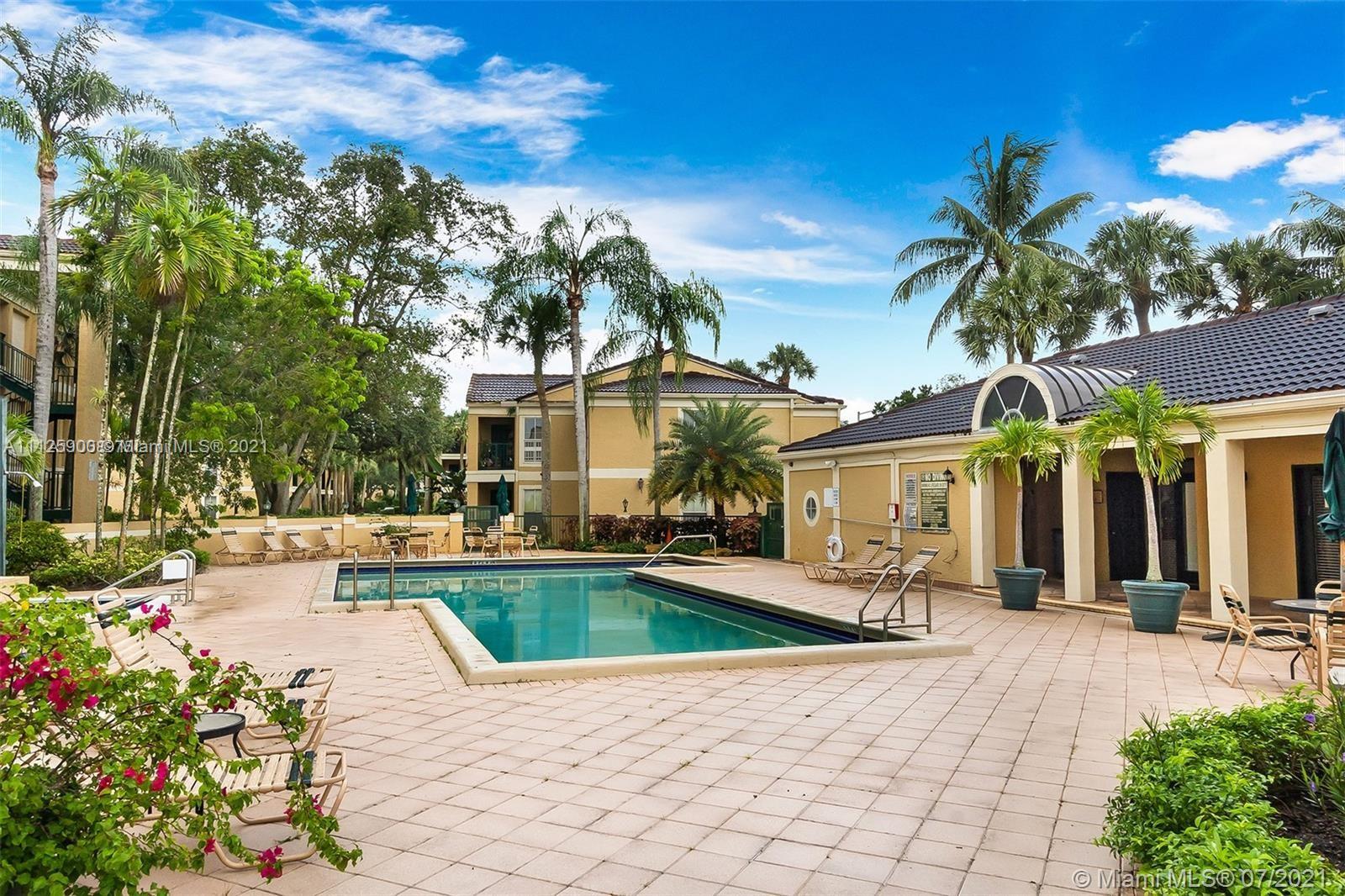 833 Riverside Drive, Unit 817 Coral Springs, FL 33071 - Photo 4 of 10 a view of a house with swimming pool and sitting area