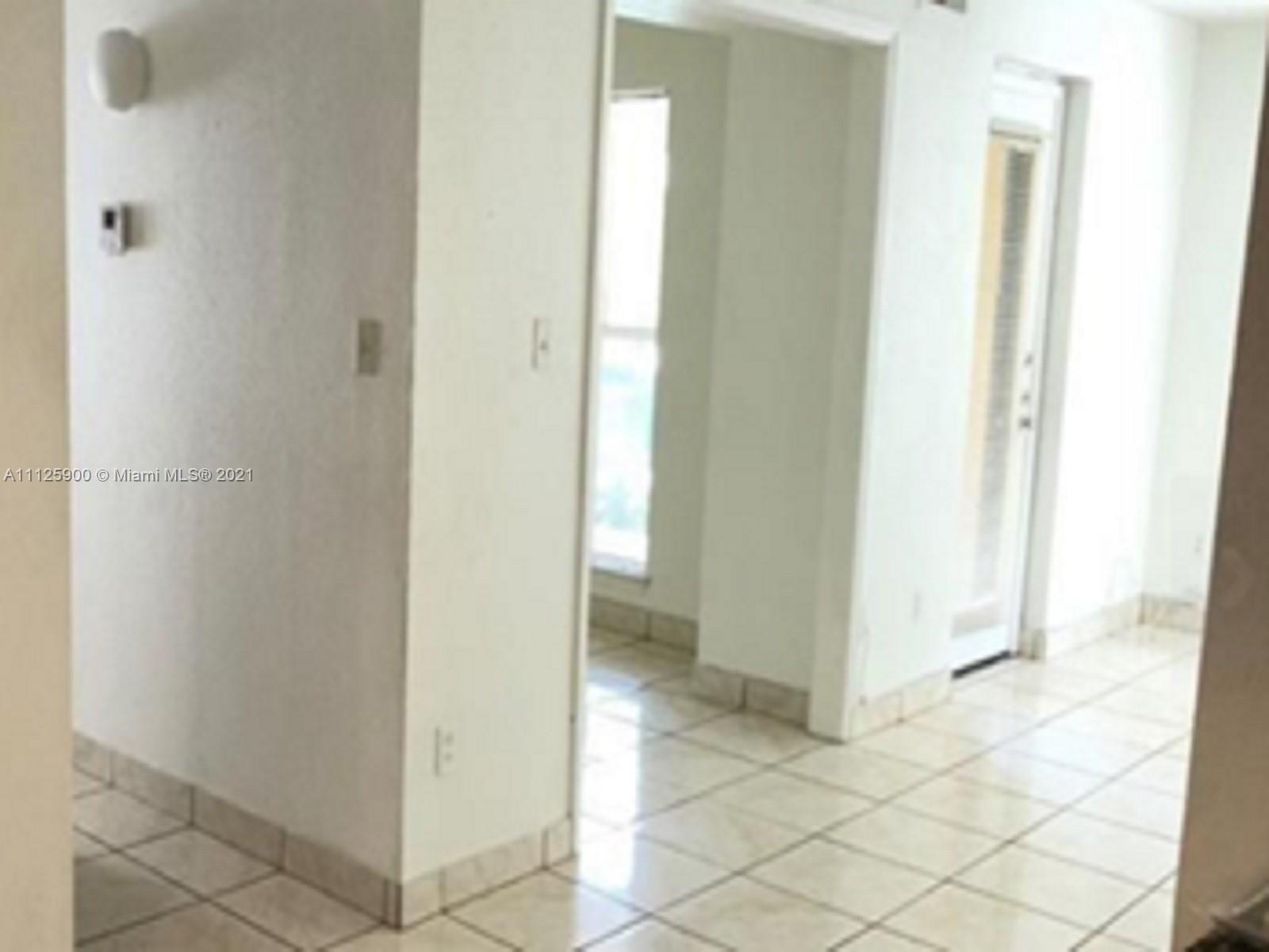 833 Riverside Drive, Unit 817 Coral Springs, FL 33071 - Photo 9 of 10 a view of a bathroom from a hallway
