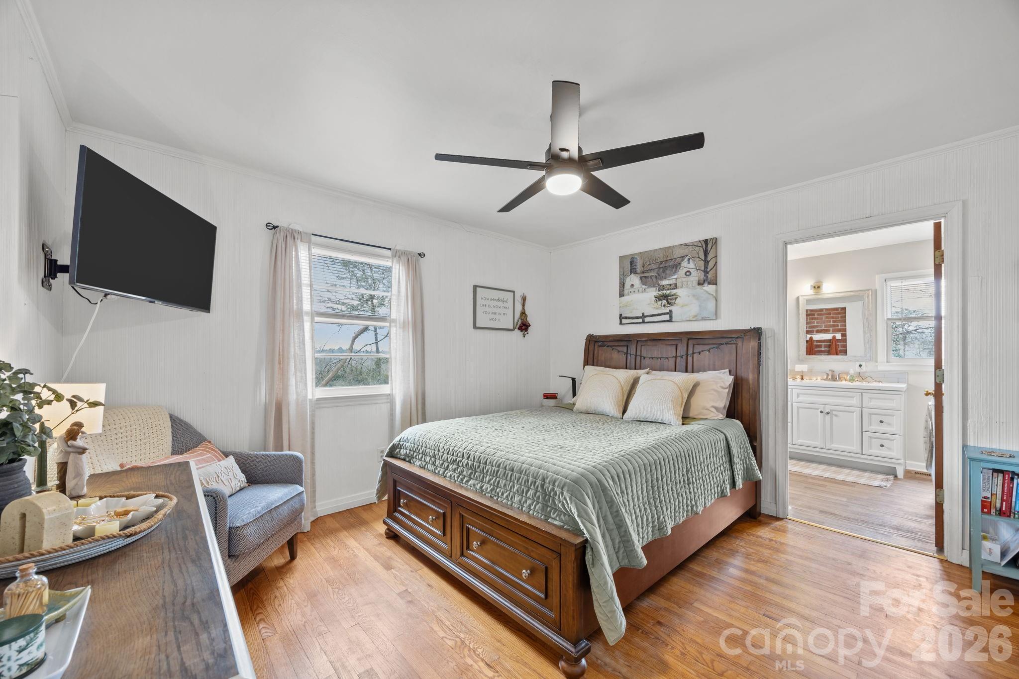 275 Tanner Street Rutherfordton, NC 28139 - Photo 29 of 44 a bedroom with a bed a couch and a window