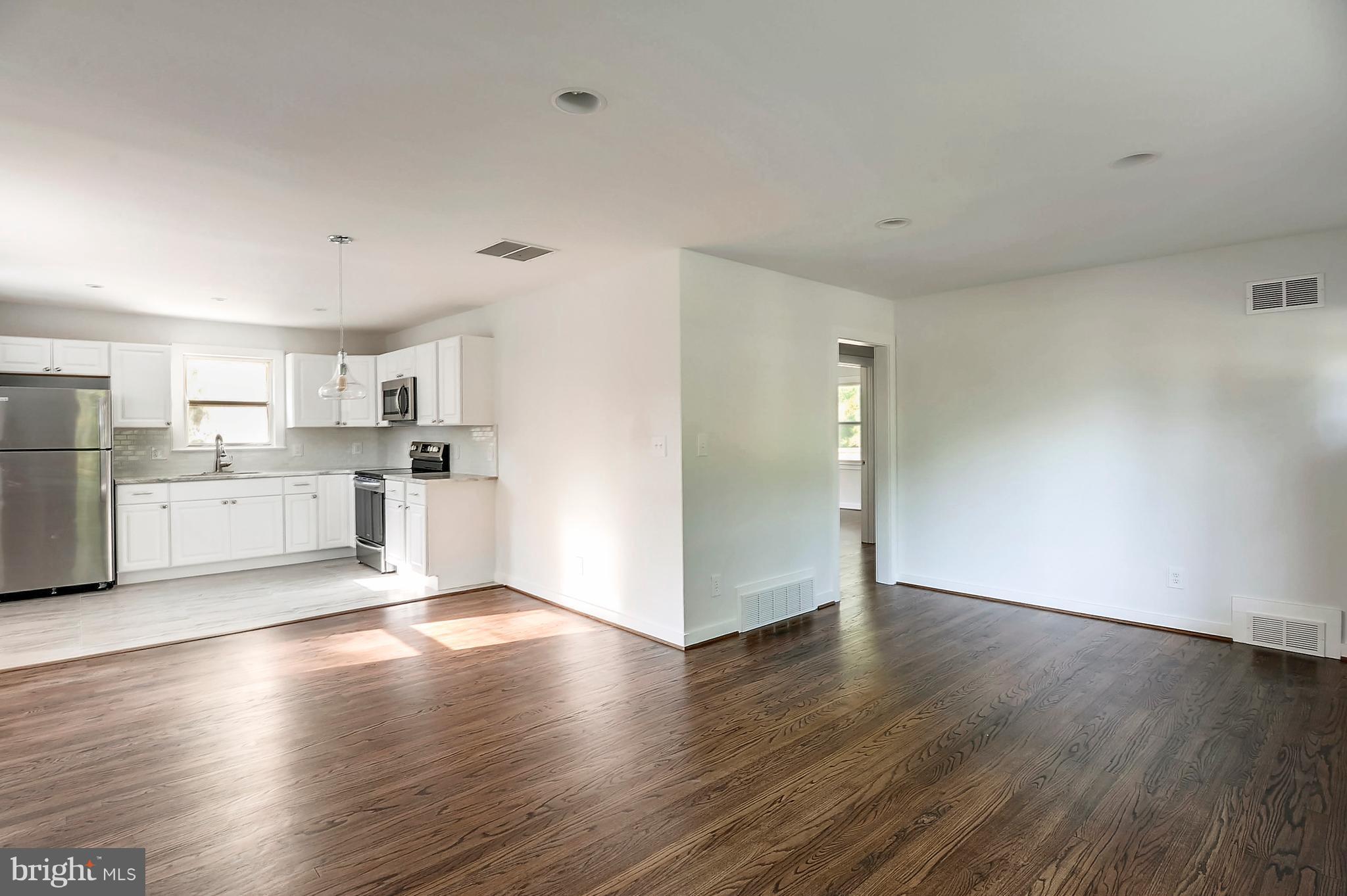 6507 Woodley Road Clinton, MD 20735 - Photo 5 of 28 Living Room Opens To Kitchen