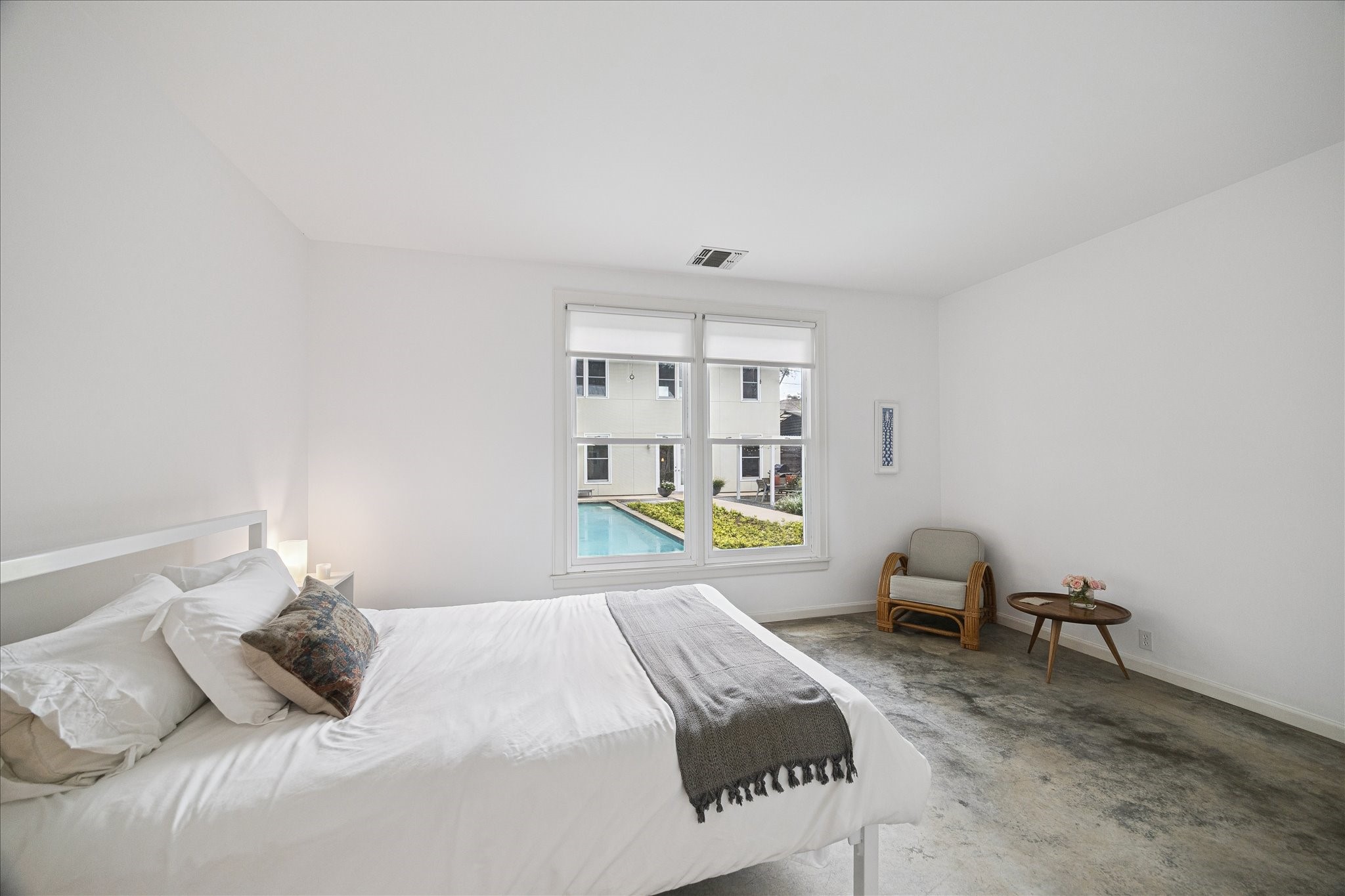1418 Kipling Street Houston, TX 77006 - Photo 30 of 42 The secondary bedroom has an amazing view of the pool and separate home space.