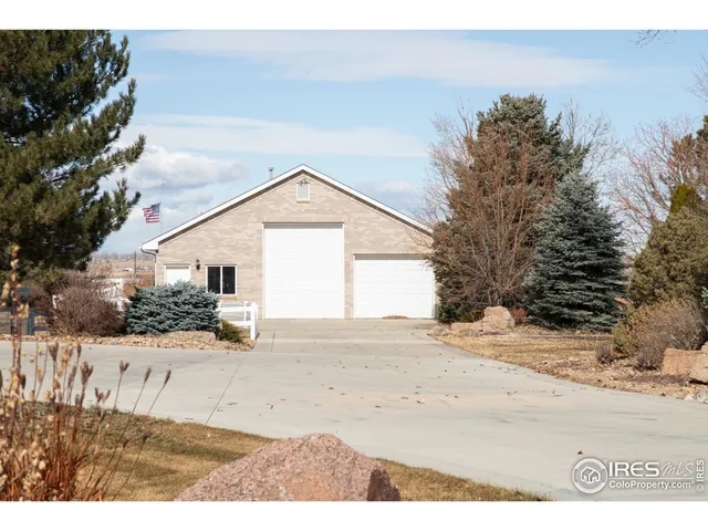 a view of a house with a snow in the yard