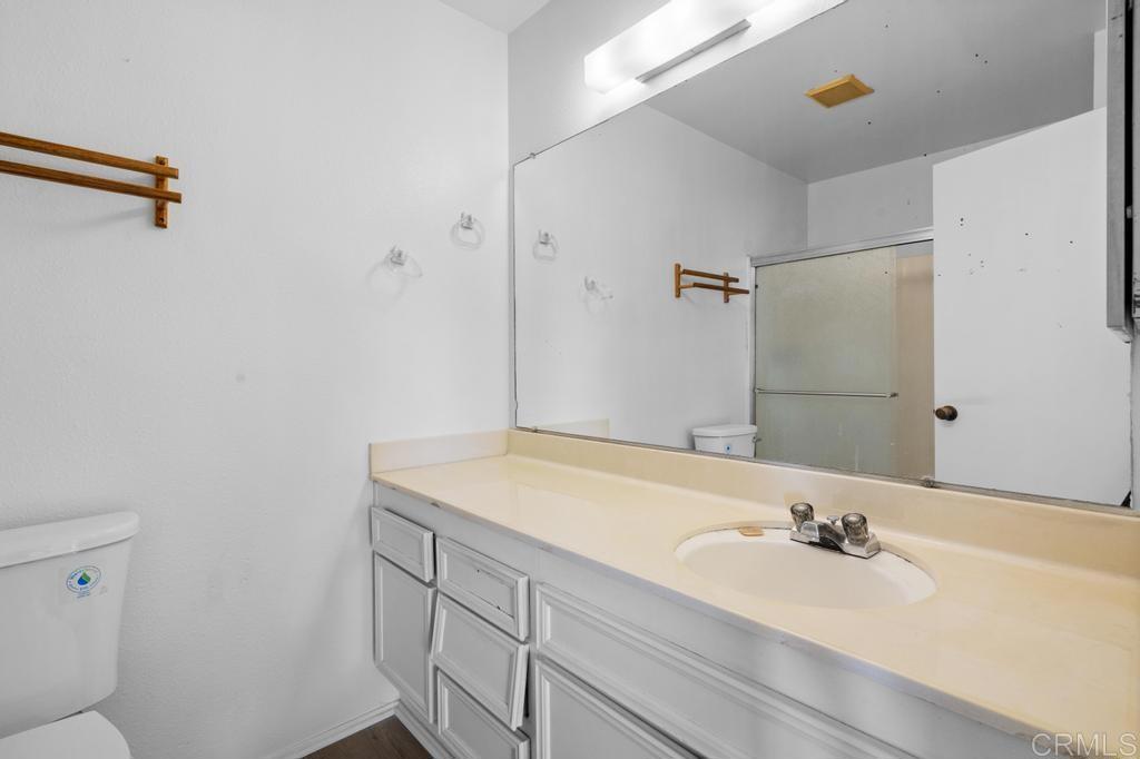 1446 Finch Street El Cajon, CA 92020 - Photo 17 of 35 a bathroom with a sink and a mirror