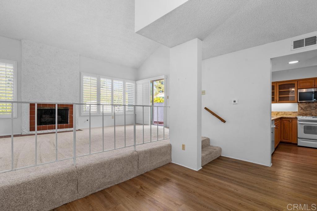 1446 Finch Street El Cajon, CA 92020 - Photo 10 of 35 a view of an empty room with a window and wooden floor