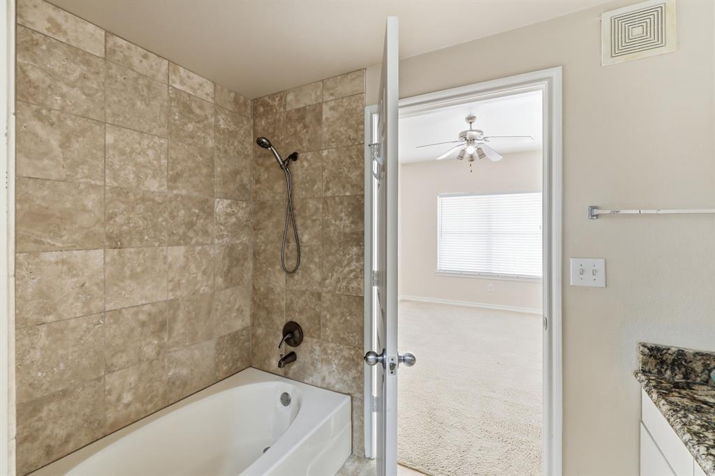 3102 Kings Road, Unit 2212 Dallas, TX 75219 - Photo 17 of 30 a bathroom with a bathtub and a shower