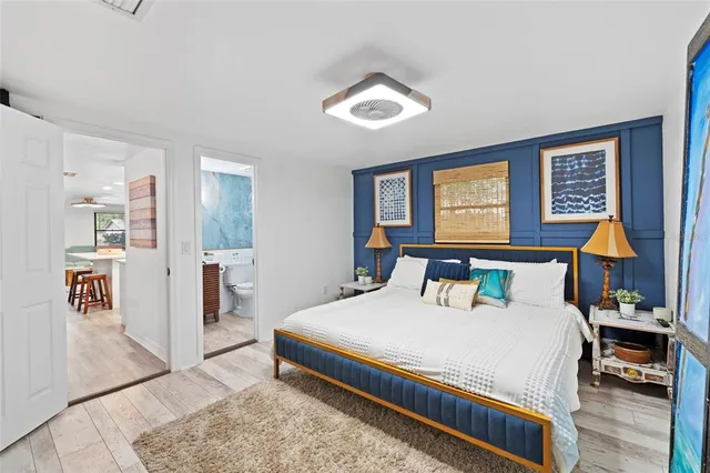 a bedroom with a bed and dresser