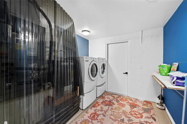a view of a city from a dining room with furniture
